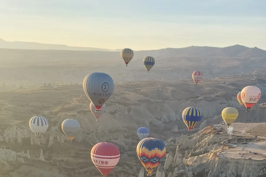 Hot air balloons over the Cappadocia landscape